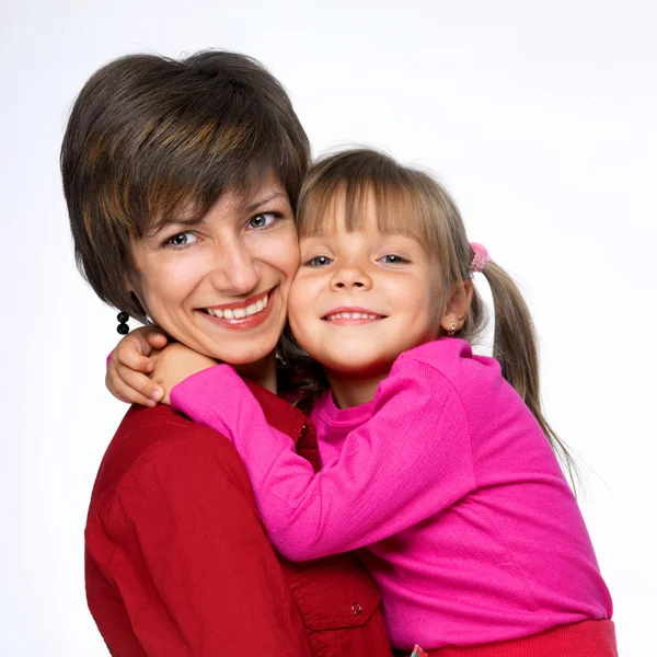 Mother with daughter on white background — Stockfoto