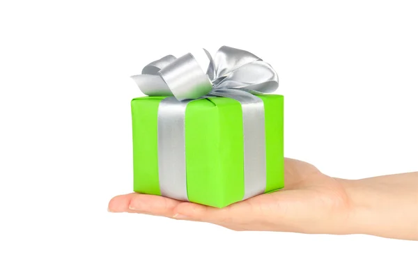 Gift box with ribbon in hand — Stock Photo, Image