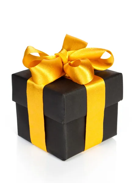 Caixa de presente preta com fita dourada — Fotografia de Stock