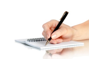 Hand with pen writing on notebook clipart