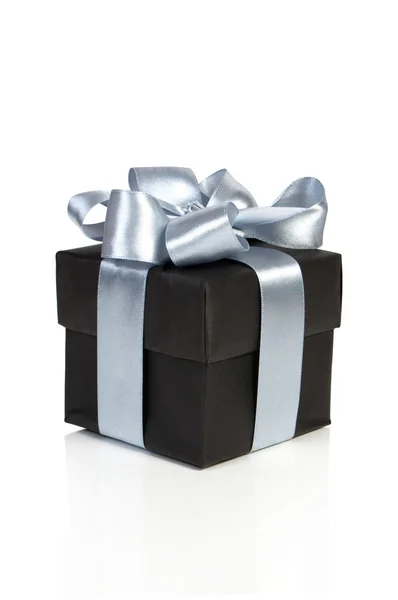 Black gift box with silver ribbon — Stock Photo, Image