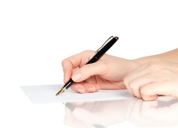 Pen in de hand schrijven op de pagina — Stockfoto