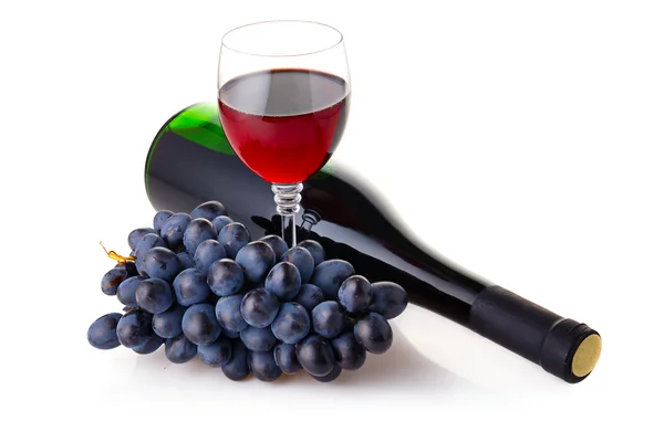 Bottle and goblet of red wine with branch of grapes isolated — Stock Photo, Image