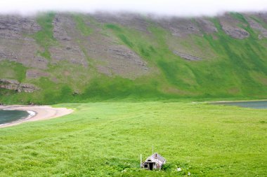 House over mountains clipart