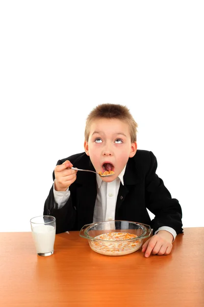 Schoolboy eating — Stock Photo, Image