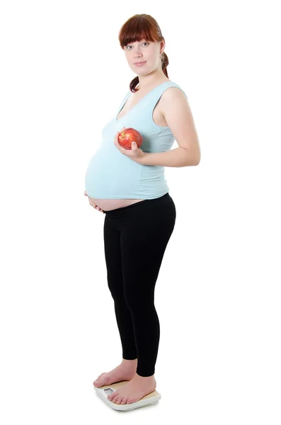 Έγκυος γυναίκα με μια μετρώντας ταινία — Φωτογραφία Αρχείου