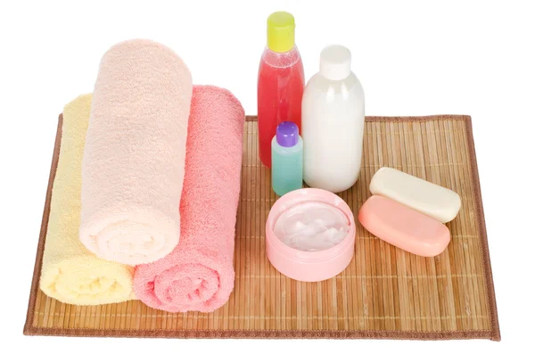 Roze gerbera en een handdoek — Stockfoto