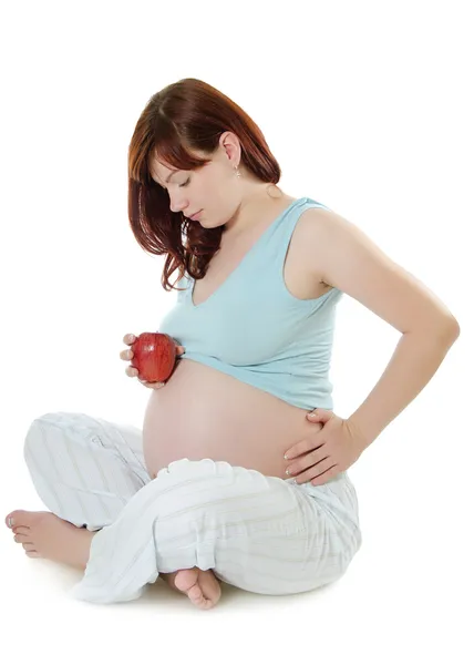 La mujer embarazada con una manzana —  Fotos de Stock
