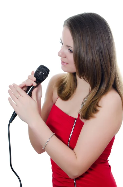 Chica con un micrófono aislado en blanco — Foto de Stock