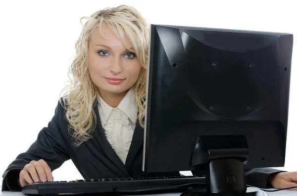 Молода дівчина за комп'ютером — стокове фото