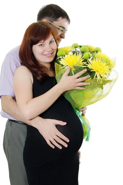 妊娠中のカップルは、白で隔離される幸せ ストック画像