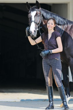 Young girl with black sport horse clipart