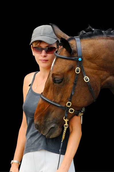 Girl with bay horse, on black background isolated — Stock Photo, Image