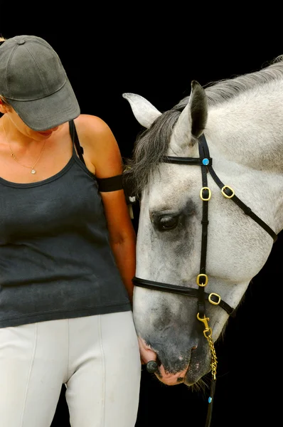 Meisje met grijze paard, op zwarte achtergrond geïsoleerd — Stockfoto