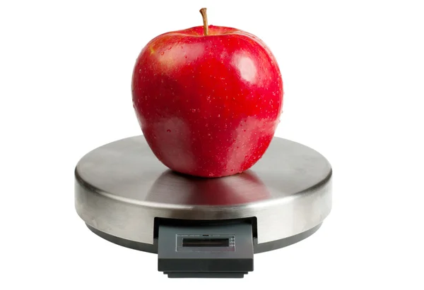 Apple on a scales — Stock Photo, Image