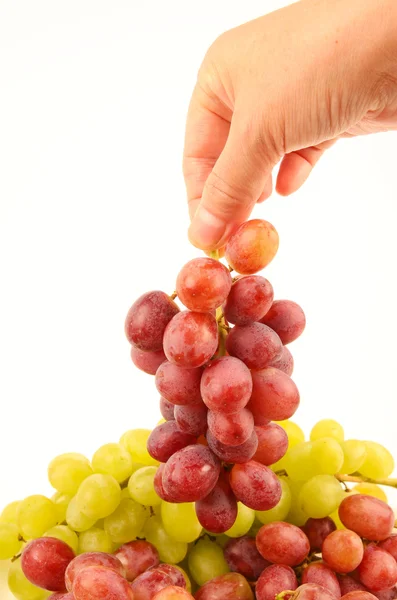 Mani femminili con uva fresca Immagini Stock Royalty Free
