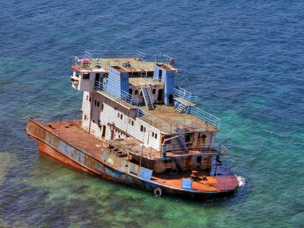 stock image The destroyed ship in the sea.