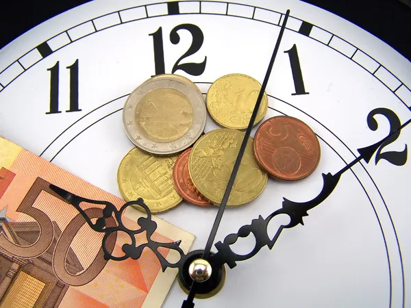 stock image Watches and coins of euro.