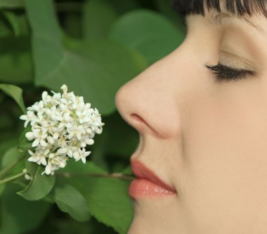 Young Woman Enjoying Smelling aroma Flowers clipart