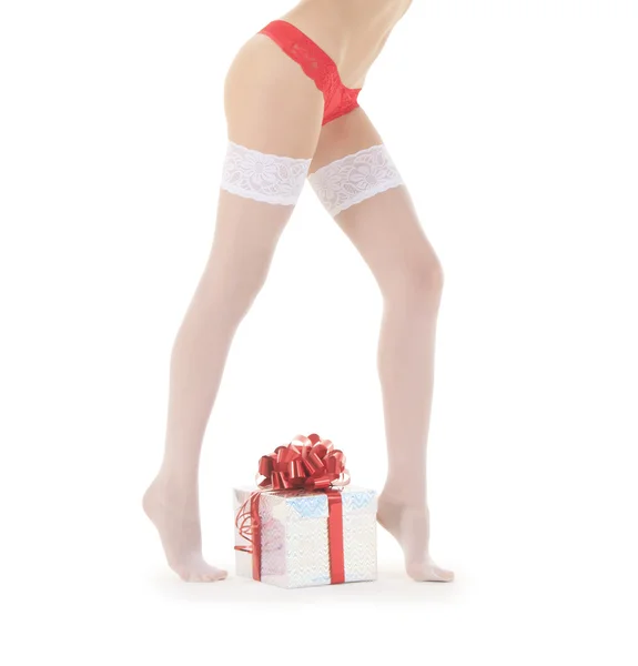 Wonderful female in santa hat and white stockings with christmas — Stock Photo, Image