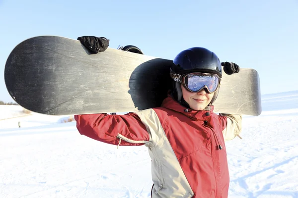 Mulher snowboarder na neve . — Fotografia de Stock