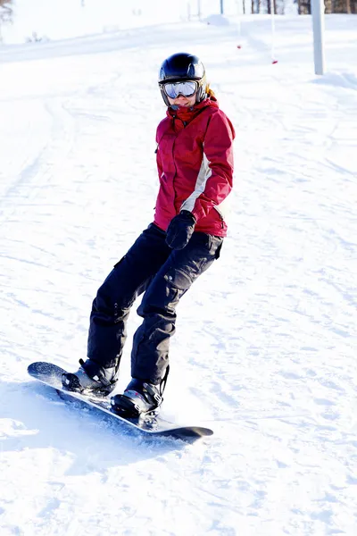 stock image Female snowboarder on the snowhill