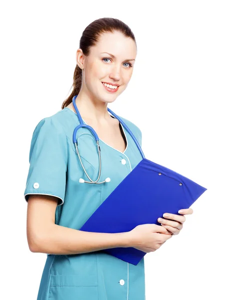 Pretty female doctor or nurse with clipboard Royalty Free Stock Photos