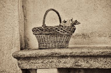 Wicker basket on a bench clipart