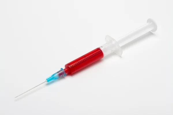 Syringe with blood — Stock Photo, Image