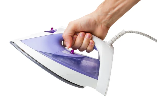 Hand with an electric iron — Stock Photo, Image