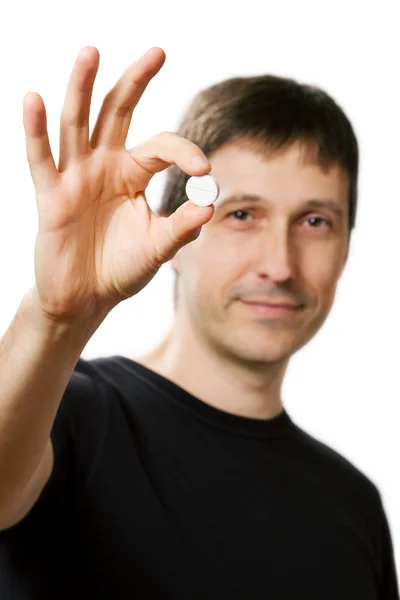 Young man showing medical pill and giving ok — Stock Photo, Image