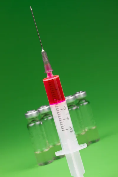 Syringe and medical ampules — Stock Photo, Image