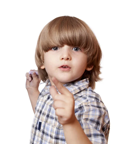 A shouting boy is pointing forward — Stock Photo, Image