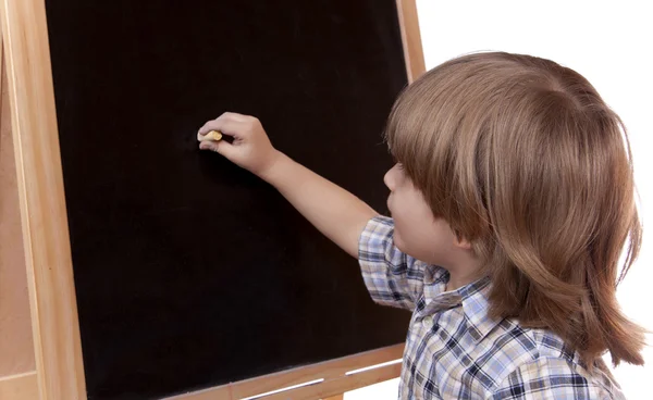 一个男孩在黑板上的肖像 — 图库照片