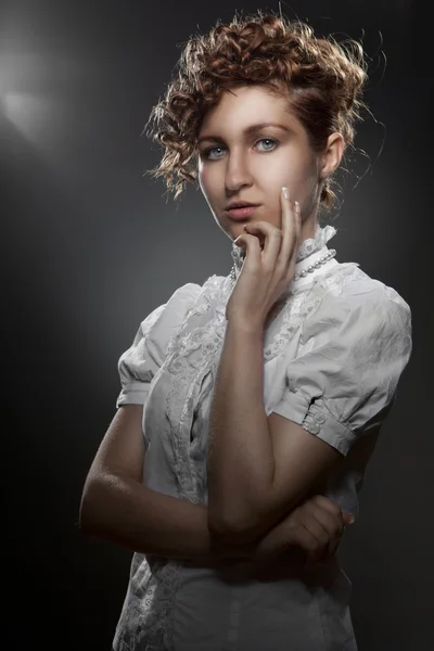 Portrait of young beautiful woman on black — Stock Photo, Image