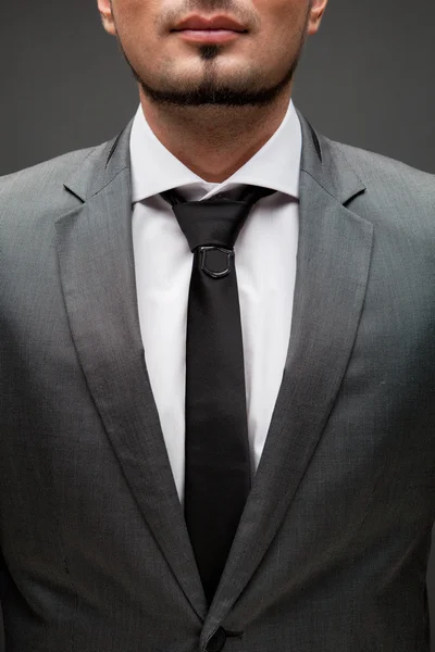 Closeup portret van knappe zakenman op zwart — Stockfoto