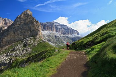 Mountain biker on Pordoi pass clipart