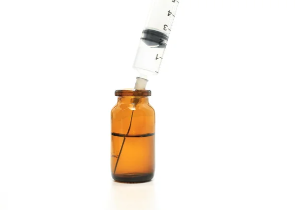 Jeringa y frasco de vidrio — Foto de Stock
