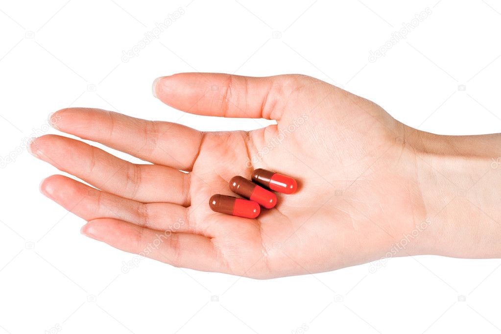 Capsules in woman's hand