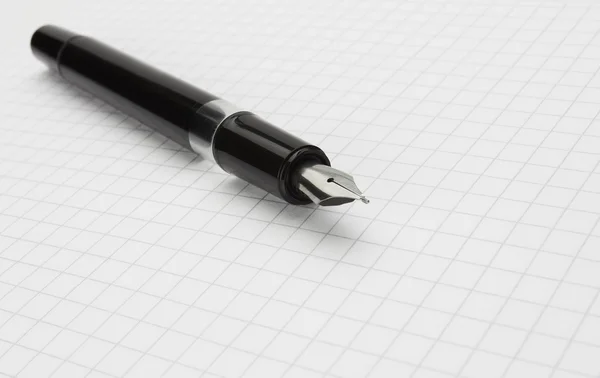 Чорнильна ручка на блокноті — стокове фото