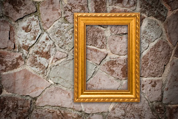 Guld ram på en gammal vägg bakgrund — Stockfoto