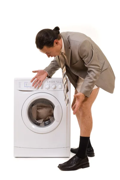 Man wipes trousers in the washing machine — Stock Photo, Image