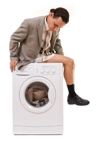 Man wipes trousers in the washing machine — Stock Photo, Image