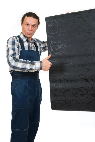 Trabalhador com papéis de parede em mãos sobre fundo branco — Fotografia de Stock