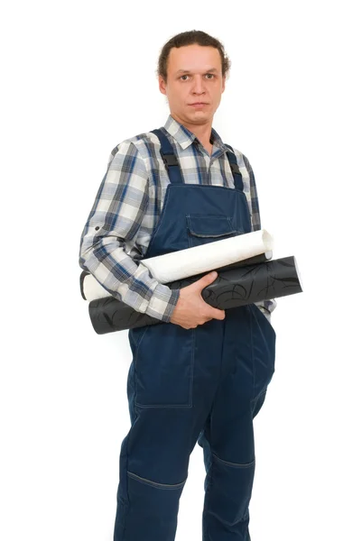 Worker with wallpapers in hands on white background — Stock Photo, Image