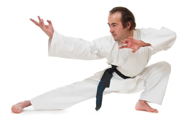 Karate bojovník na bílém pozadí — Stock fotografie