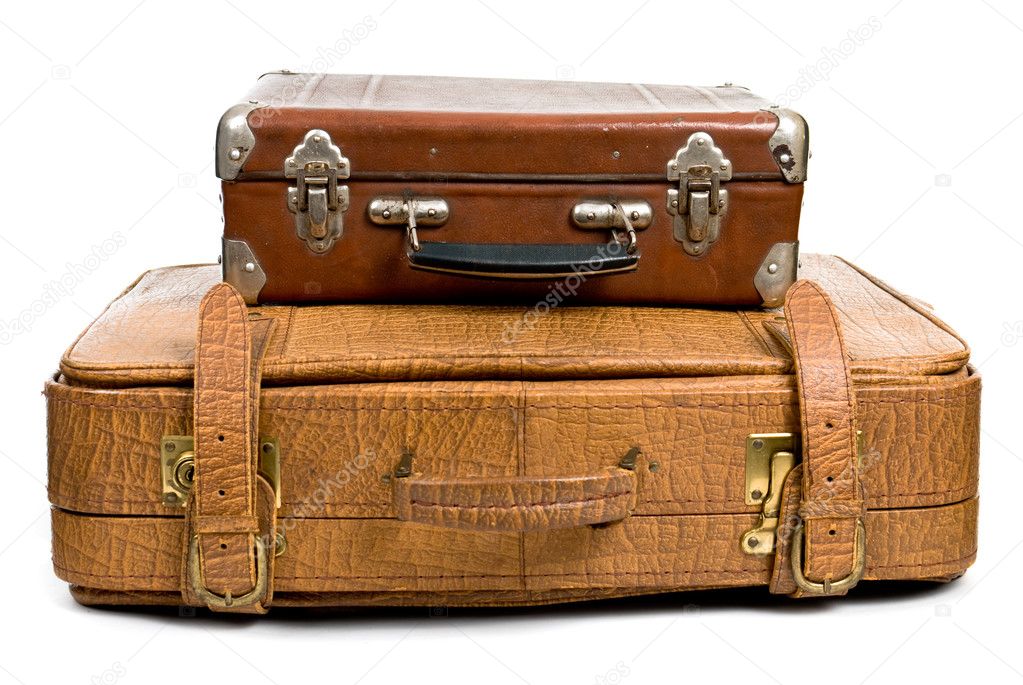 Old suitcases isolated on a white background