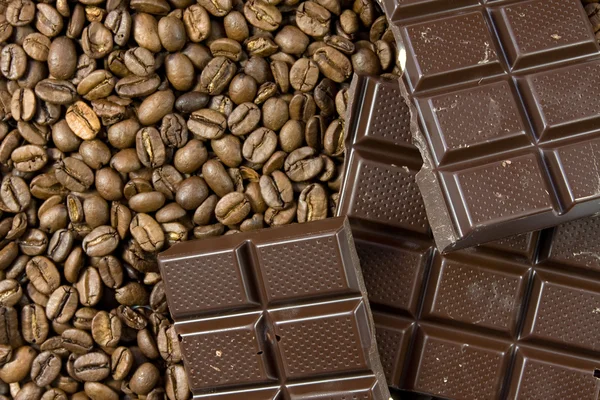 Coffee beans and dark chocolate — Stock Photo, Image