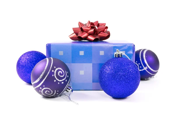 Christmas baubles and gift — Stock Photo, Image