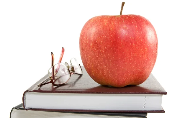 红苹果和眼镜的书 — 图库照片